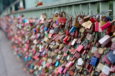 Padlocks hanging on railing