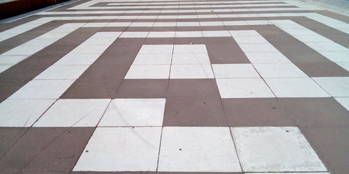 High angle view of zebra crossing on tiled floor