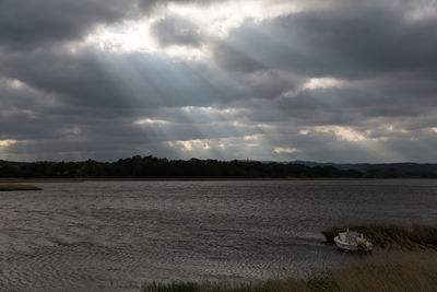 Scenic view of storm clouds over landscape