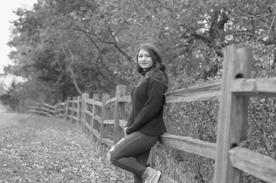 Portrait of woman against plants