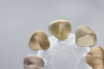 Close-up high angle view of objects over white background