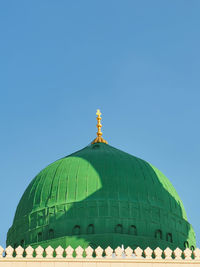 Low angle view of a building against clear blue sky