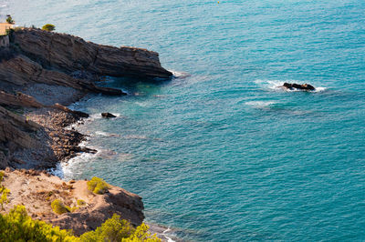 High angle view of rock formation in sea