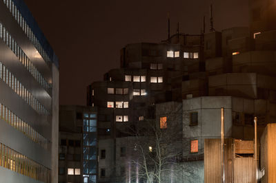 Buildings in city at night