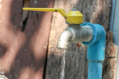 Close-up of faucet against wall