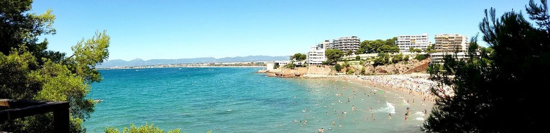 Scenic view of sea against clear blue sky