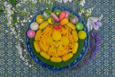 High angle view of yellow flowers on table