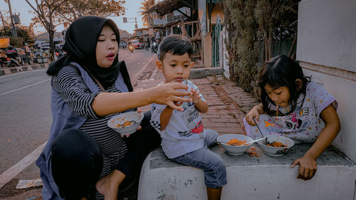 Portrait of mother feeding the child