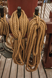 High angle view of rope tied on wood