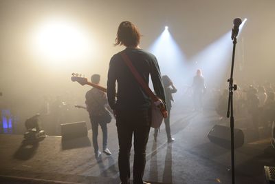 Musicians performing on stage during concert