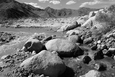 Panoramic view of rocks on land against sky