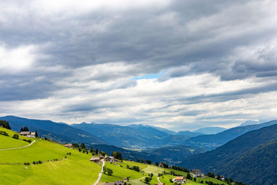 Scenic view of landscape and mountains against sky