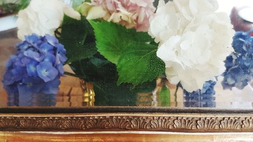 Close-up of white flower vase on table