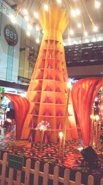 Low angle view of illuminated lanterns in restaurant at night