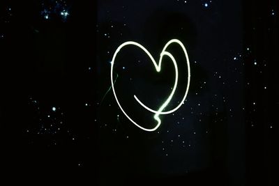 Low angle view of heart shape at night