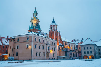 View of buildings in city during winter