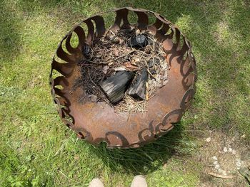 High angle view of old rusty metal on field