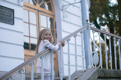 Beautiful little child girl walking in a city 