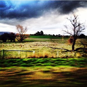 Scenic view of landscape against cloudy sky