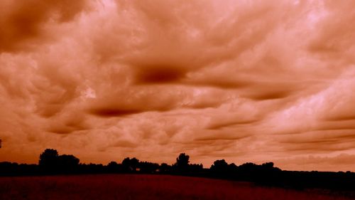 Scenic view of dramatic sky over landscape