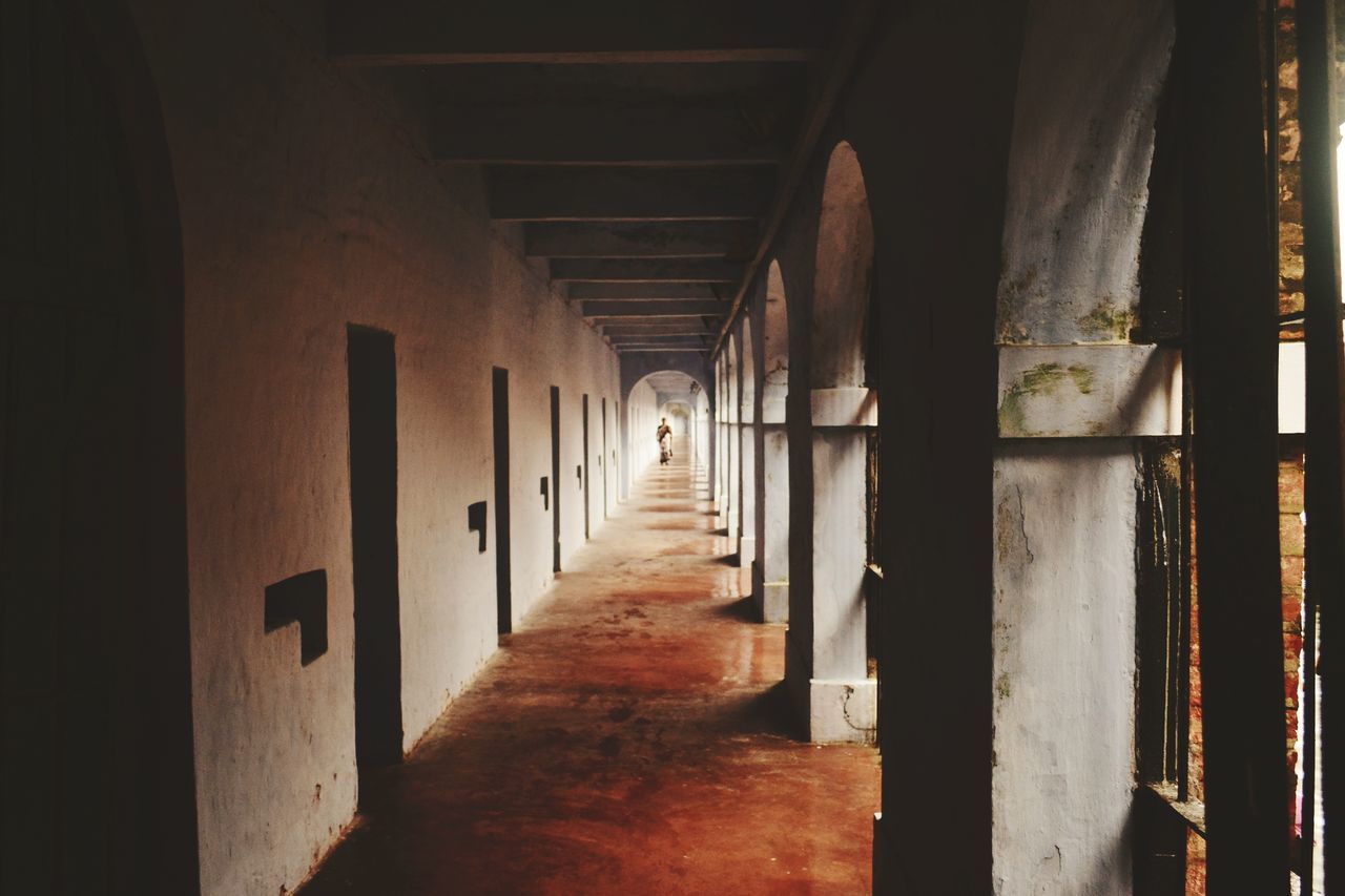 architecture, indoors, the way forward, built structure, architectural column, corridor, diminishing perspective, column, in a row, vanishing point, narrow, colonnade, empty, long, ceiling, arch, history, building, pillar, no people