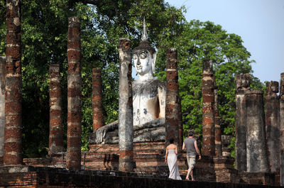 Low angle view of large buddha statue