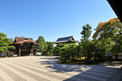 View of trees and buildings against sky