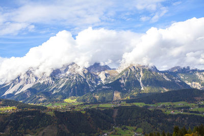 Scenic view of mountains covered with clouds