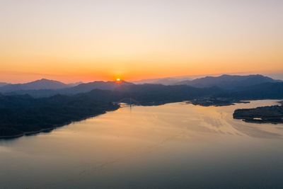 Scenic view of mountains against sky during sunset