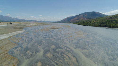 Parched river in mountain province luzon. drought in mountain valley, dry and shallow bucao river.