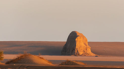 Scenic view of desert against clear sky