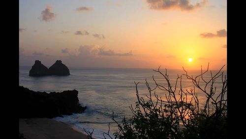 Scenic view of sea at sunset