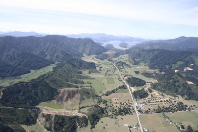 Aerial view of agricultural landscape against sky