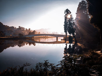 Bridge over river with city in background