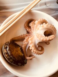 High angle view of octopus in plate on table