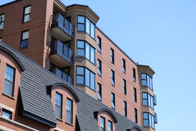 Low angle view of building against clear blue sky