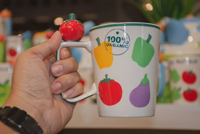 Close-up of hand holding ice cream