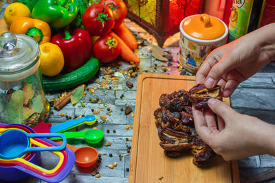 Cropped hand of person preparing food