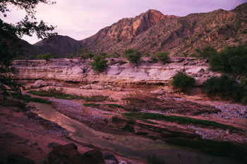 High angle view of stream against mountains