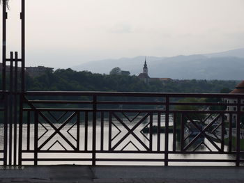 Scenic view of building and mountains against sky