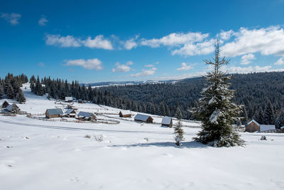 Alpine village in transylvania, romania. snow covered houses in wintertime