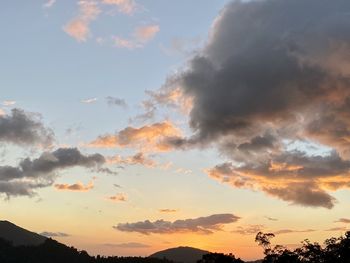 Low angle view of dramatic sky during sunset