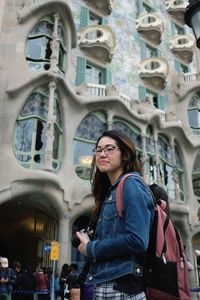 Woman standing in front of building