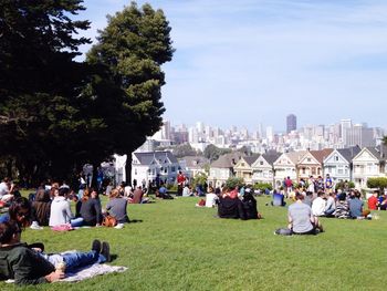 People at park in front of seven sisters houses