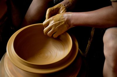 Cropped image of man molding clay