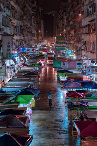 High angle view of illuminated buildings in city at night