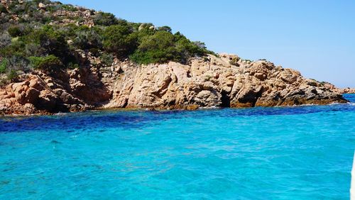 Scenic view of sea against clear blue sky