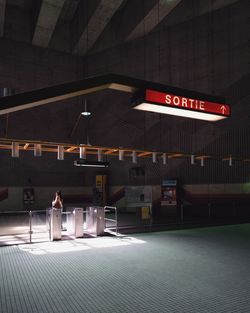 Information sign in illuminated restaurant
