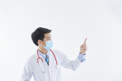 Full length of young man against white background