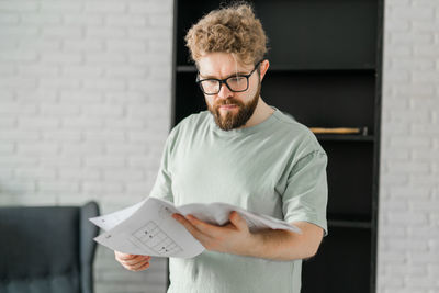 Portrait of young man using mobile phone